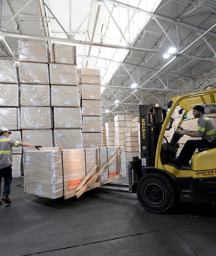 warehouse employee driving forklift