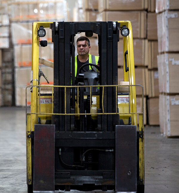 forklift driver on warehouse floor