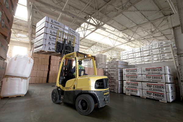 forklift driver lifting wood products