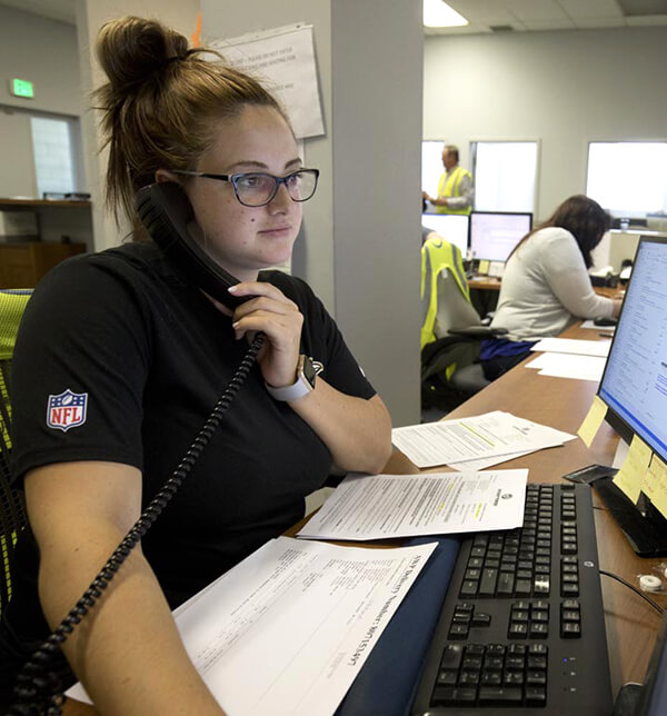 female office employee answering the phone